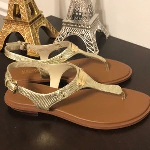 Gold Michael Kors thong sandals